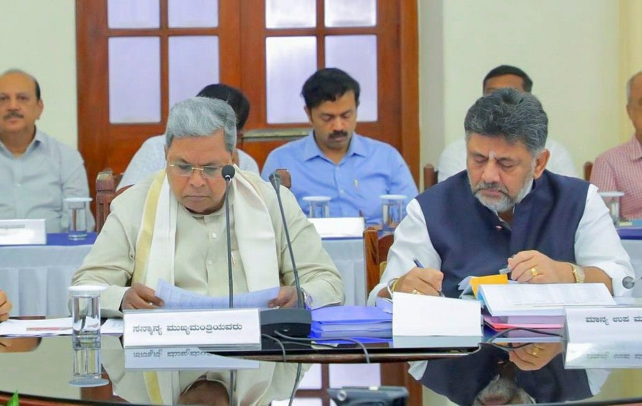 X/@DKShivakumar : Karnataka Chief Minister Siddaramaiah (C) with Deputy CM DK Shivakumar (R)